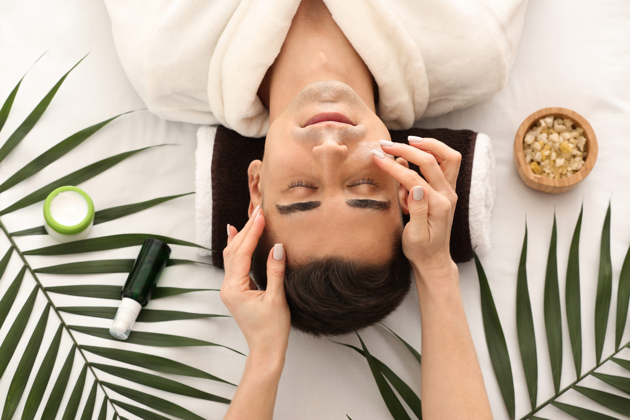 Man receiving face massage in beauty salon at The Best Injector